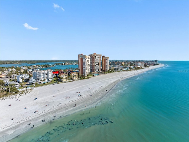 birds eye view of property with a city view, a beach view, and a water view