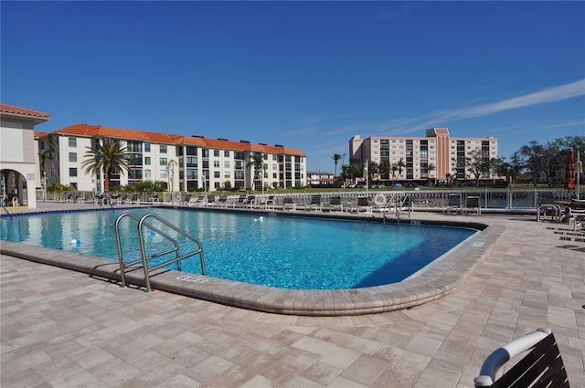 view of swimming pool with a patio area