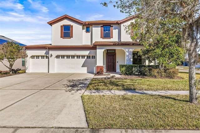 view of front facade with a garage and a front lawn