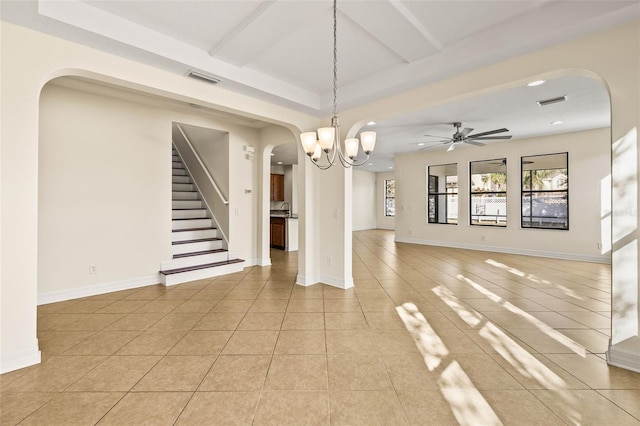 interior space featuring beam ceiling, ceiling fan with notable chandelier, and light tile patterned floors