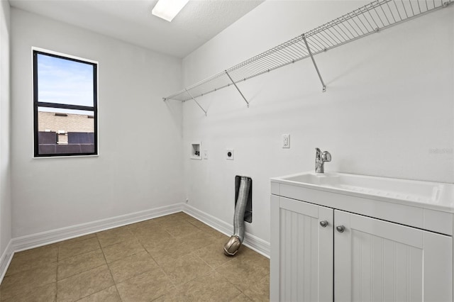 laundry area with cabinets, electric dryer hookup, washer hookup, and light tile patterned floors