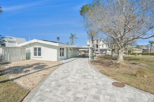 view of front of home with a carport