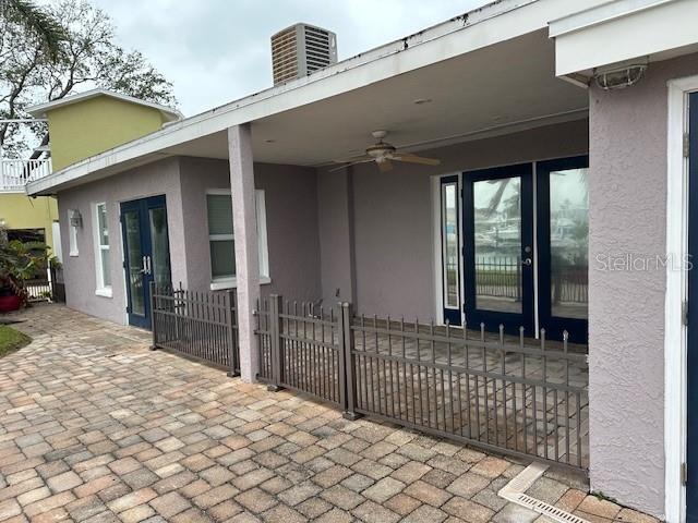 view of patio / terrace featuring ceiling fan and central air condition unit