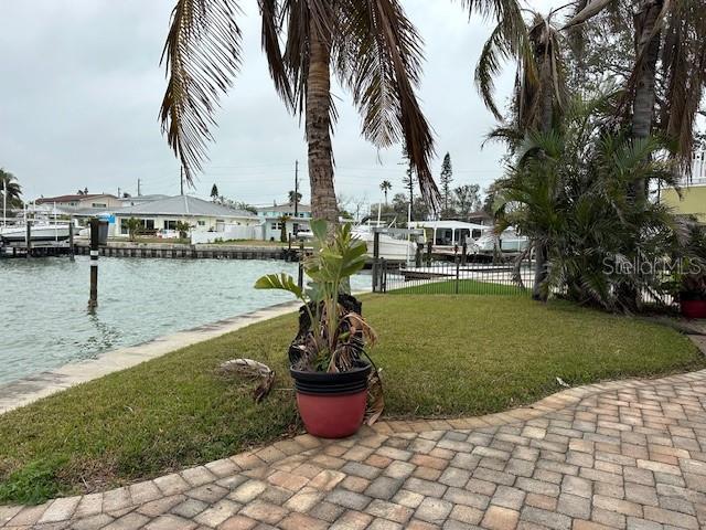 exterior space with a yard and a water view