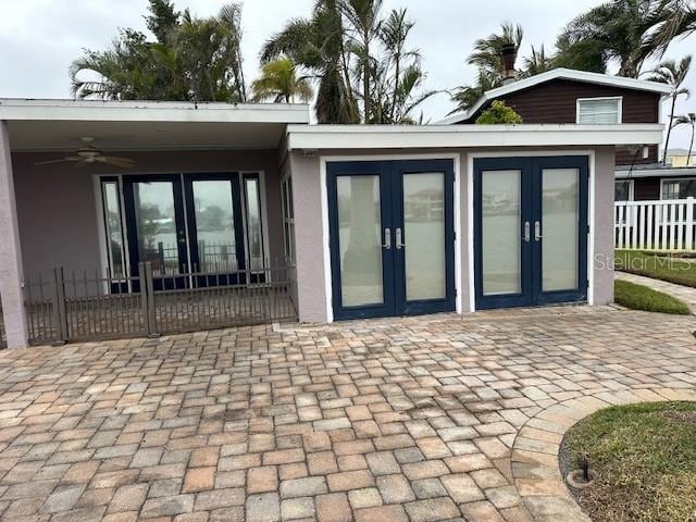 back of property featuring a patio area, ceiling fan, and french doors