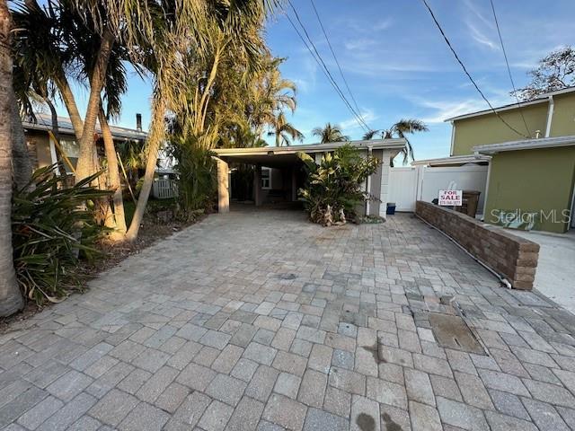 exterior space with a carport