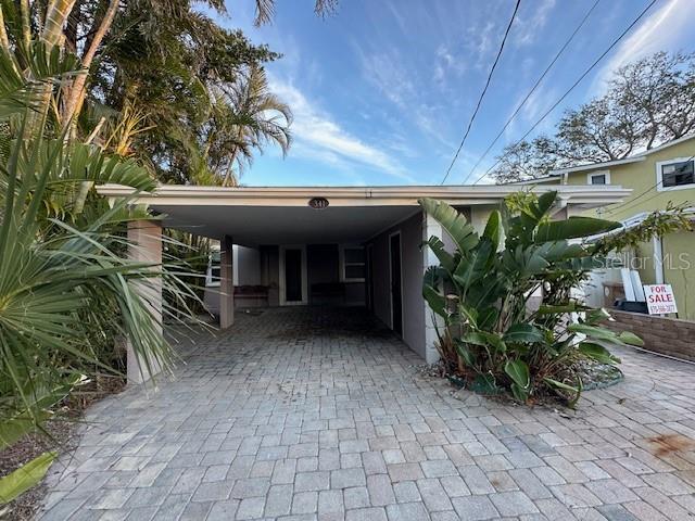 exterior space with a carport