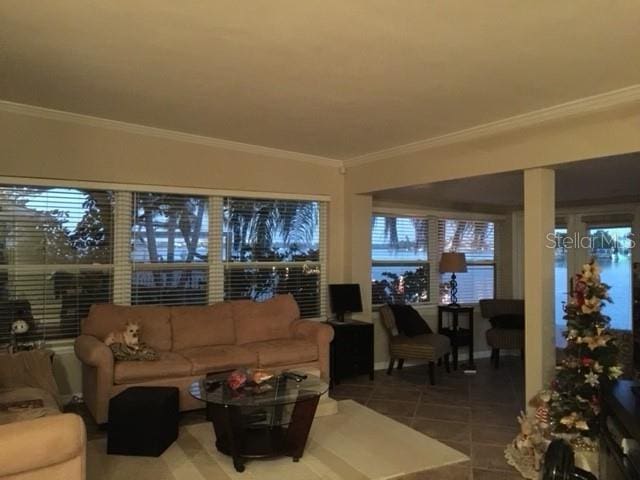 interior space with crown molding and tile patterned floors