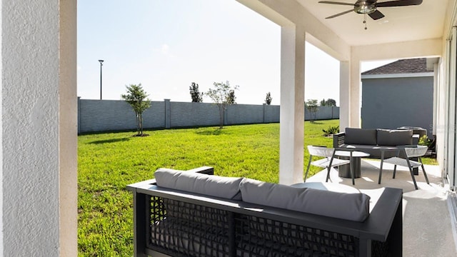 view of patio with ceiling fan and an outdoor living space