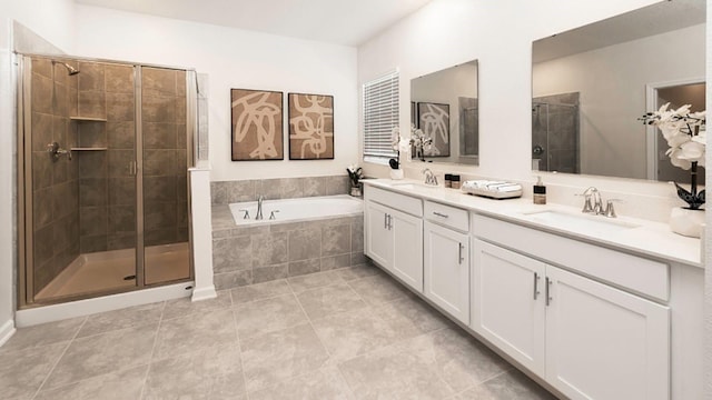 bathroom featuring independent shower and bath, vanity, and tile patterned floors