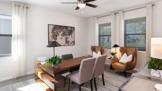 office space with ceiling fan and light wood-type flooring