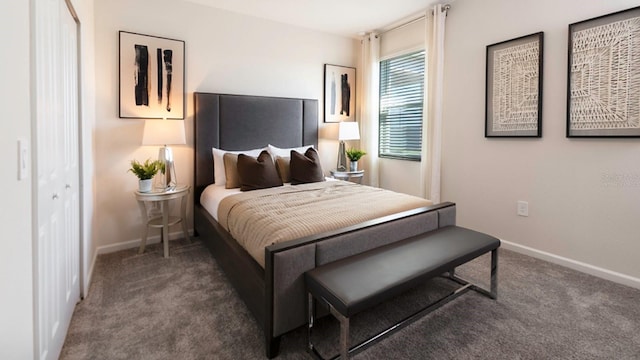 bedroom featuring a closet and dark colored carpet