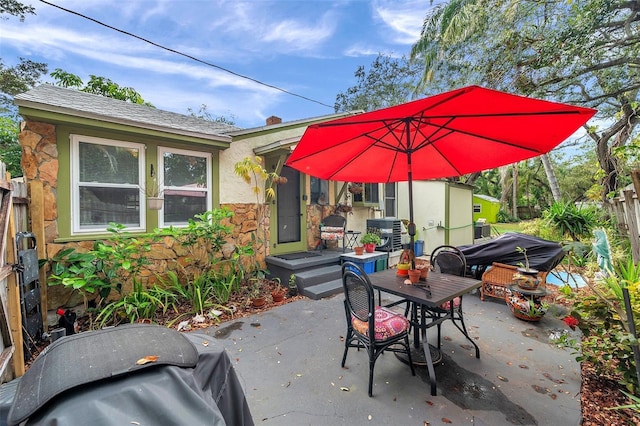 view of patio featuring a grill