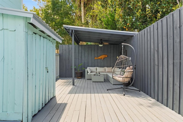 deck featuring ceiling fan and outdoor lounge area