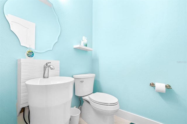 bathroom with tile patterned floors and toilet