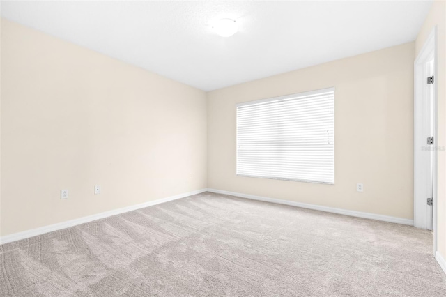 spare room with light carpet