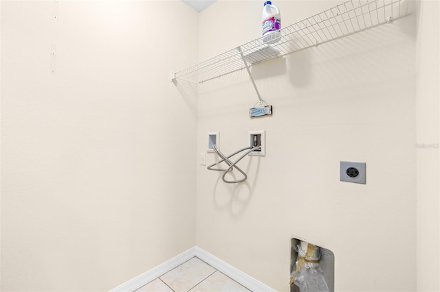 laundry area featuring washer hookup, hookup for an electric dryer, and light tile patterned floors