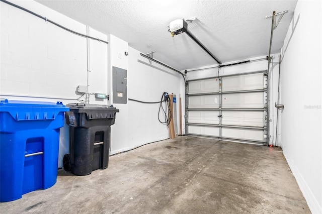 garage featuring a garage door opener and electric panel