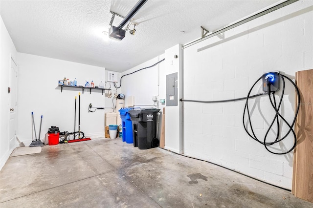 garage featuring a garage door opener and electric panel