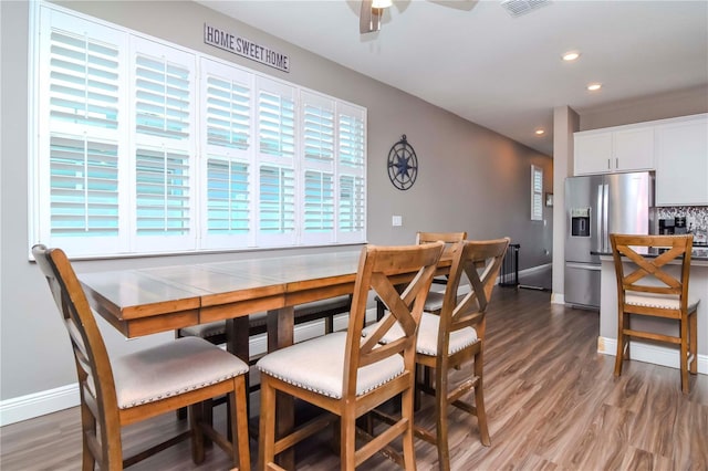 dining area featuring ceiling fan and hardwood / wood-style floors