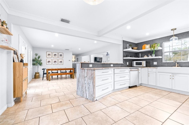 kitchen featuring decorative light fixtures, white cabinetry, decorative backsplash, light stone counters, and beam ceiling