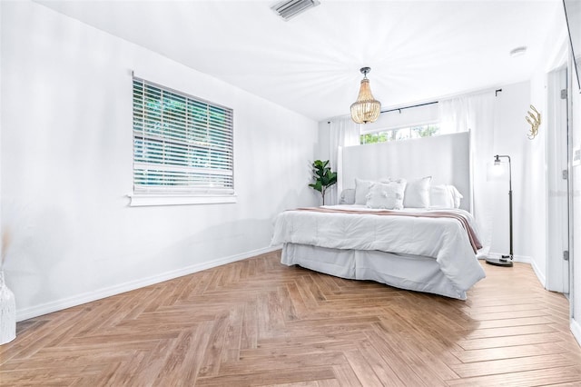 bedroom featuring light parquet floors