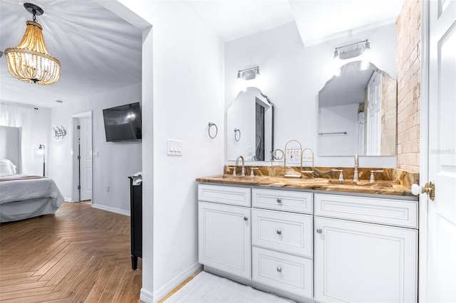 bathroom featuring vanity and parquet floors