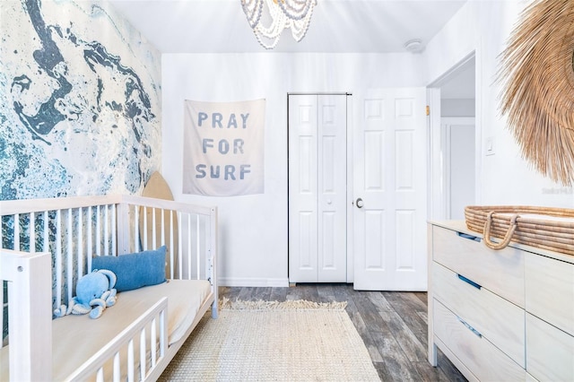 bedroom featuring dark hardwood / wood-style floors and a closet