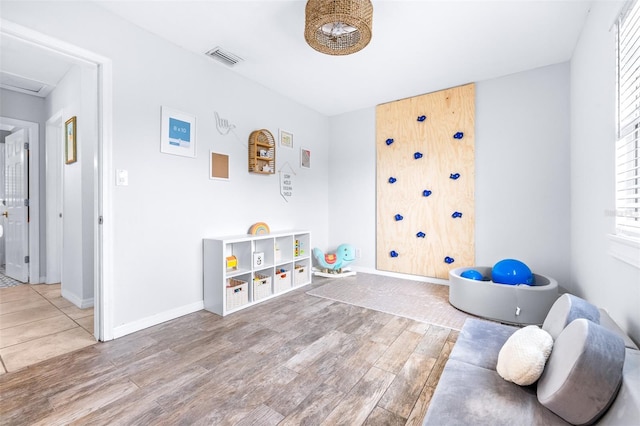 playroom with hardwood / wood-style flooring