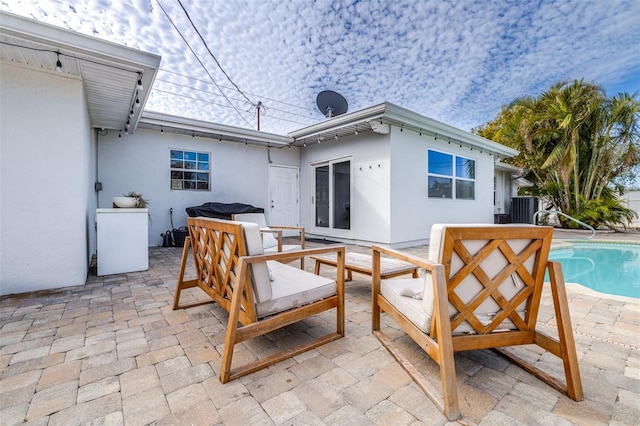 back of property with a patio and central air condition unit