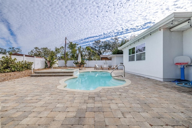 view of pool featuring a patio