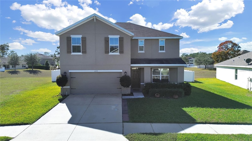 front of property featuring a garage and a front lawn