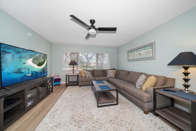 living room featuring ceiling fan and light wood-type flooring