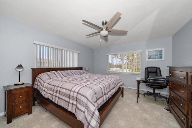 bedroom featuring ceiling fan and light colored carpet