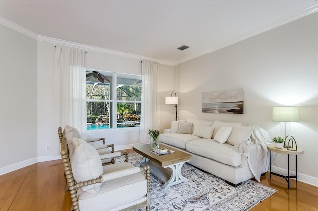 living room featuring crown molding and wood-type flooring