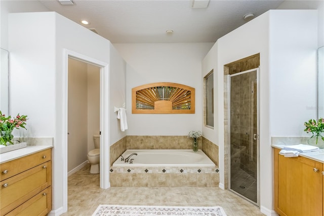 full bathroom featuring tile patterned floors, vanity, toilet, and independent shower and bath