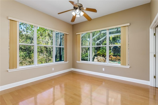 empty room featuring ceiling fan and light wood-type flooring