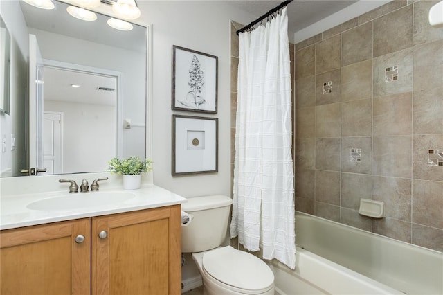 full bathroom featuring shower / bathtub combination with curtain, vanity, and toilet