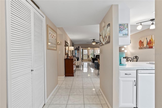 hallway with light tile patterned floors