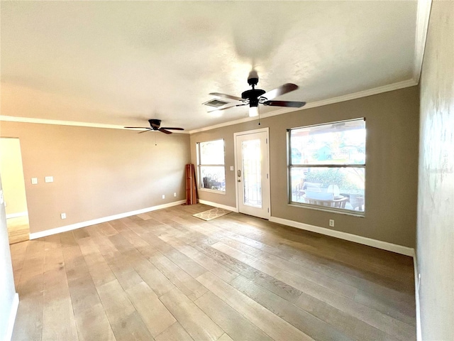 empty room featuring ceiling fan, ornamental molding, a healthy amount of sunlight, and light wood-type flooring