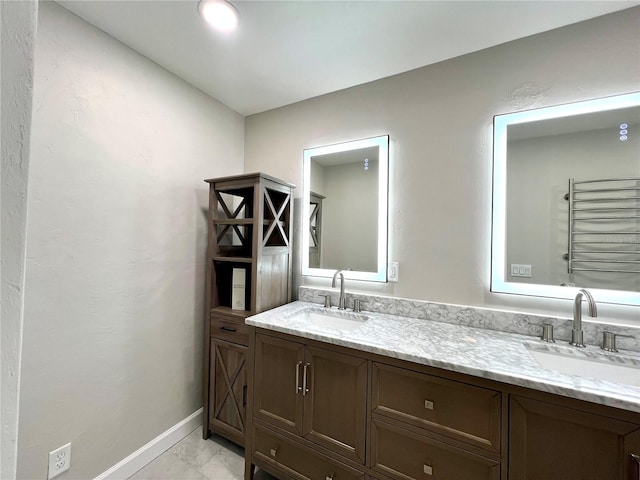 bathroom with vanity and radiator heating unit