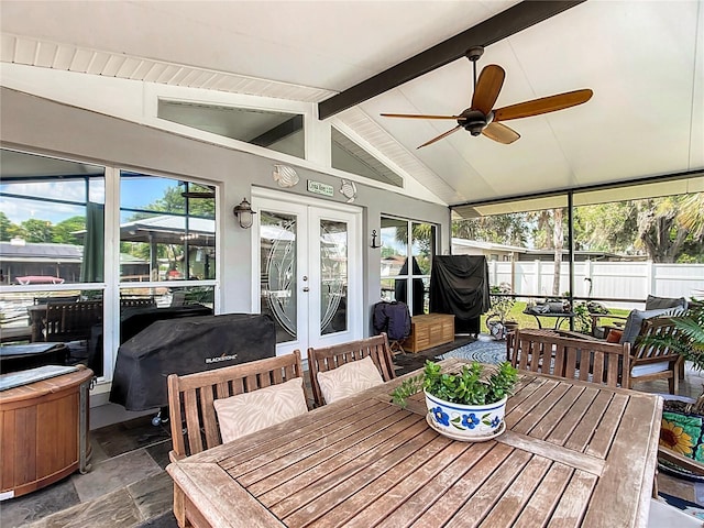 sunroom with vaulted ceiling with beams, french doors, and ceiling fan