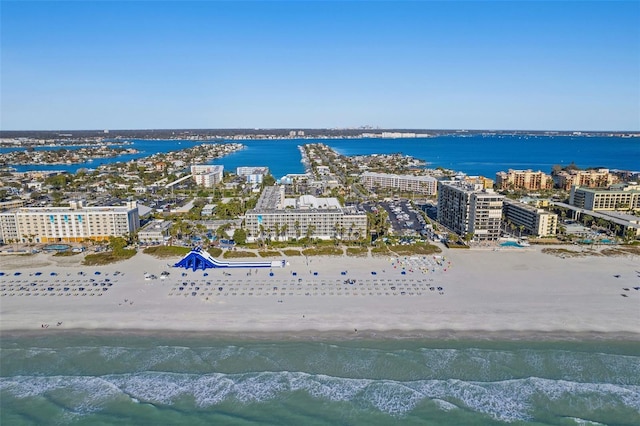 drone / aerial view with a water view and a beach view