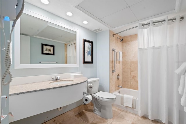 full bathroom featuring tile patterned flooring, toilet, vanity, and shower / bath combo with shower curtain