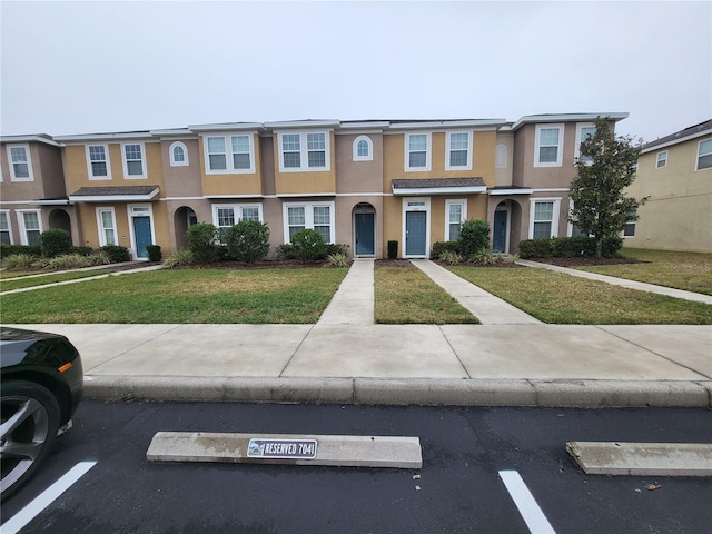 view of property with a front lawn