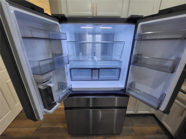 room details featuring white cabinetry, fridge with ice dispenser, and dark hardwood / wood-style floors