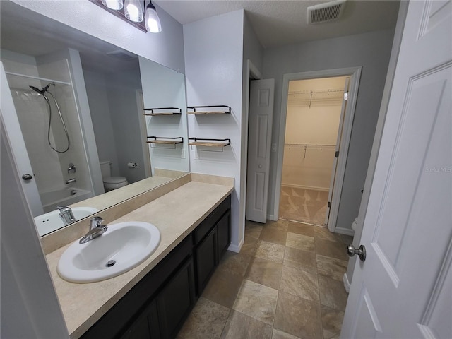 full bathroom with vanity, toilet, and shower / washtub combination