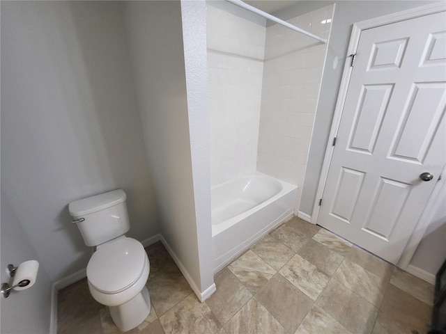 bathroom with toilet and tiled shower / bath combo