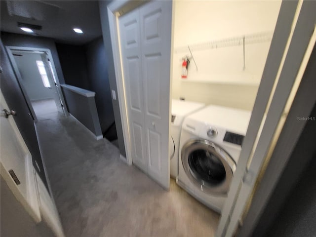 laundry room with washing machine and dryer