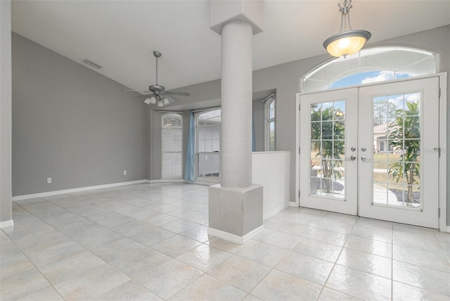 tiled foyer entrance featuring french doors, ceiling fan, and ornate columns